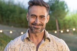 Good looking man portrait posing smiling in nature background in summer night